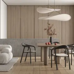 Minimalizm w domu: przytulna sofa, drewniany stół z krzesłami i dekoracje tworzą harmonię.