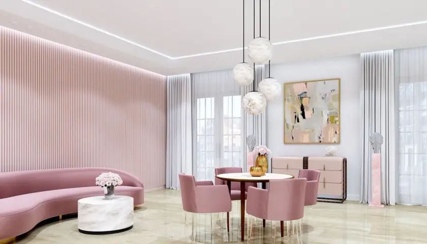 Elegancki salon w odcieniach różu z sofą, okrągłym stolikiem kawowym z blatem imitującym alabaster i krzesłami.