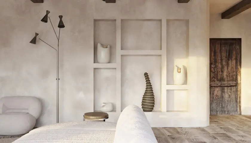 Wnętrze w stylu wabi sabi z drewnianymi belkami, tynkowanymi ścianami i rustykalnymi detalami.
