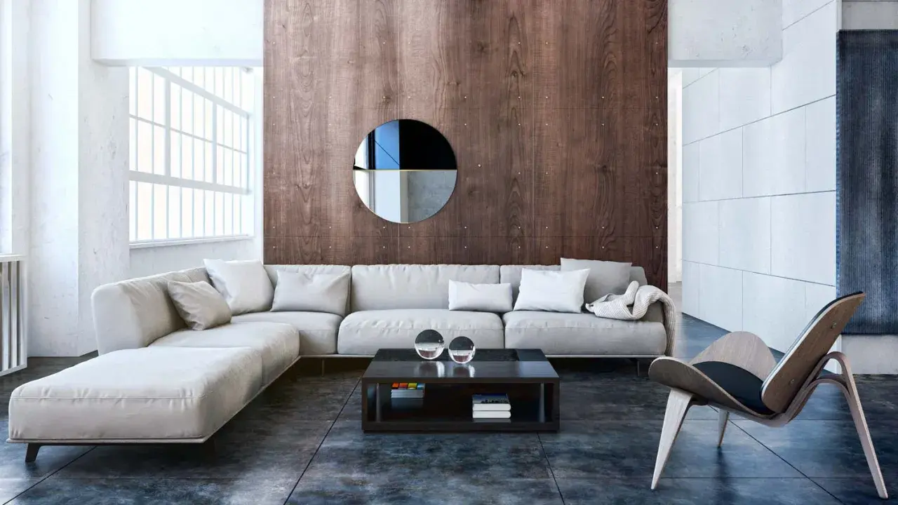 Nowoczesny salon w stylu bauhaus z wygodną, jasną sofą, drewnianą ścianą i designerskim fotelem.